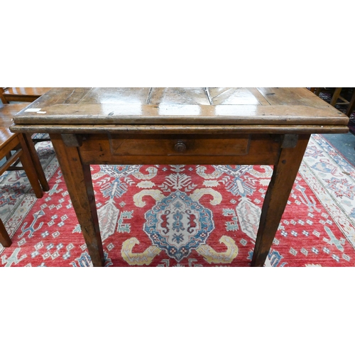 913 - An antique French fruitwood extending draw leaf dining table, with frieze drawer to one end, raised ... 