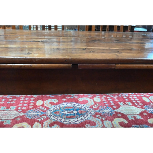 913 - An antique French fruitwood extending draw leaf dining table, with frieze drawer to one end, raised ... 