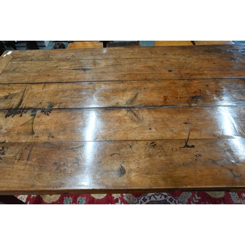 913 - An antique French fruitwood extending draw leaf dining table, with frieze drawer to one end, raised ... 