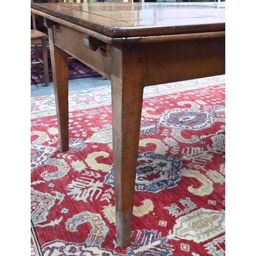 913 - An antique French fruitwood extending draw leaf dining table, with frieze drawer to one end, raised ... 