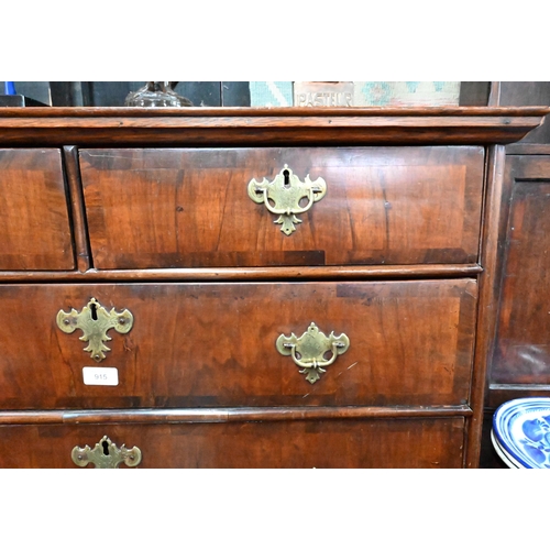 915 - An 18th century and later oak and walnut chest on stand, two short over three long graduated drawers... 