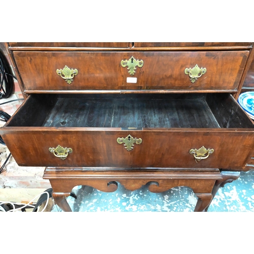 915 - An 18th century and later oak and walnut chest on stand, two short over three long graduated drawers... 