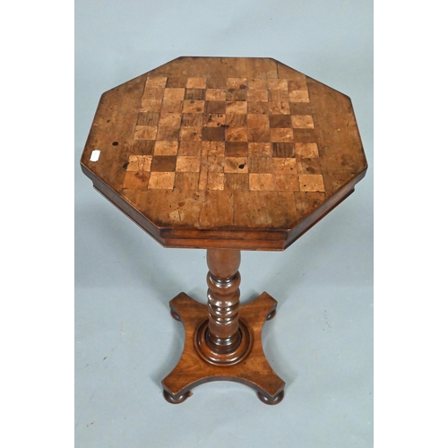 924 - A Victorian octagonal chess board inlaid games table, raised on a turned support to quad platform ba... 