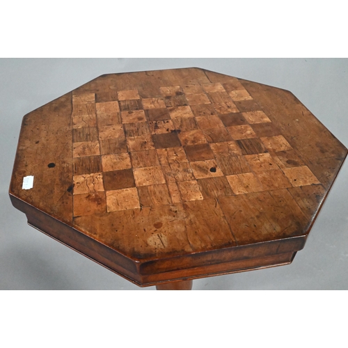 924 - A Victorian octagonal chess board inlaid games table, raised on a turned support to quad platform ba... 