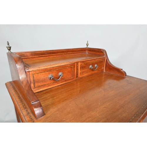 929 - An inlaid mahogany chest with two drawer stage-back over three long drawers, raised on square taperi... 