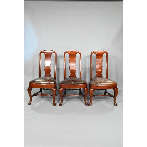 931 - A set of ten Queen Anne style dining chairs, with antiqued brown leather seat pads, raised on cabrio... 