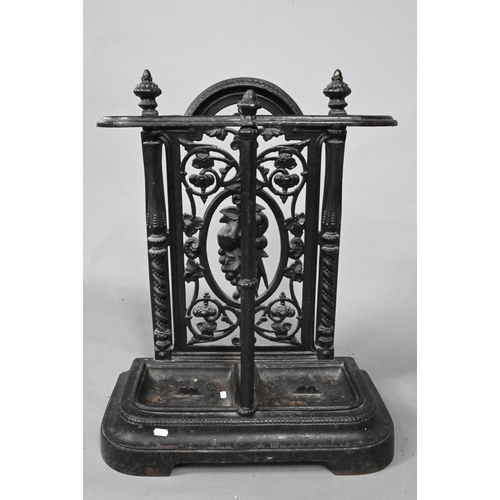 960 - A late Victorian cast iron stick stand with twin drip pans, 50 cm w x 23 cm x 69 cm h