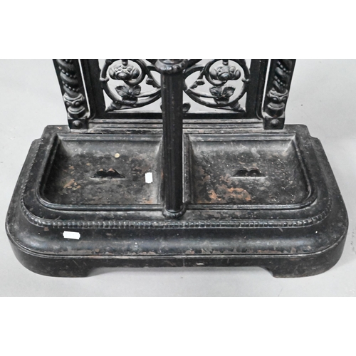 960 - A late Victorian cast iron stick stand with twin drip pans, 50 cm w x 23 cm x 69 cm h