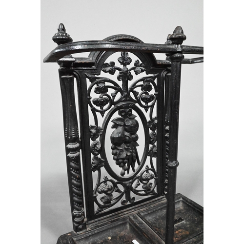 960 - A late Victorian cast iron stick stand with twin drip pans, 50 cm w x 23 cm x 69 cm h