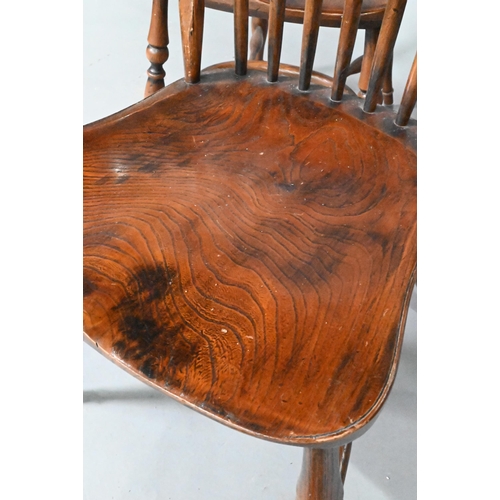 963 - A set of eight late 19th century elm and ash spindle back chairs with crinoline stretchers (8)