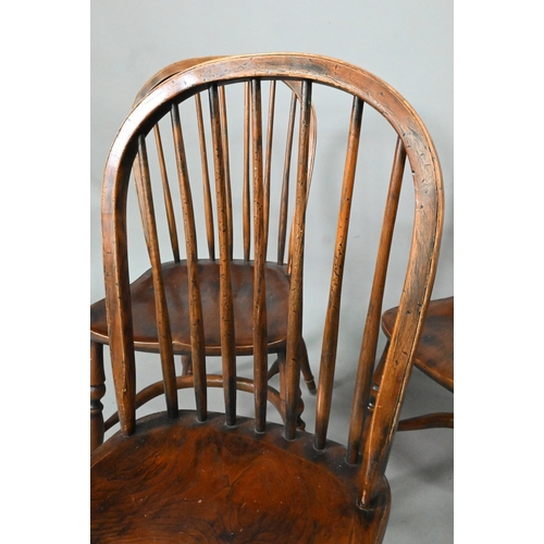 963 - A set of eight late 19th century elm and ash spindle back chairs with crinoline stretchers (8)