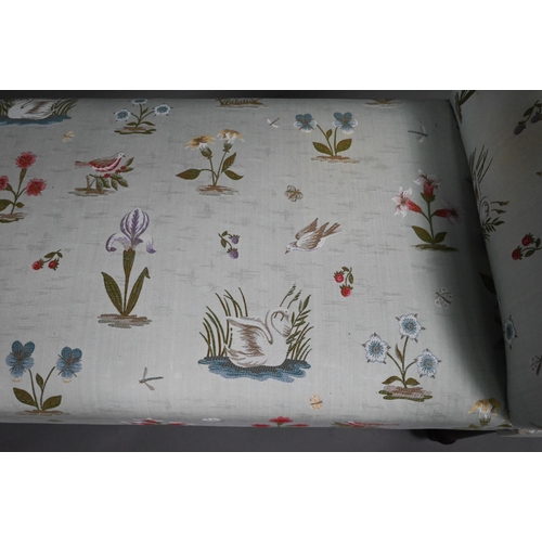 964 - An upholstered Victorian style twin scroll end window seat on turned legs with floral and bird desig... 