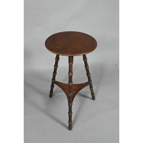 965 - A late Arts & Crafts circular occasional table, raised on three turned bamboo style legs united ... 