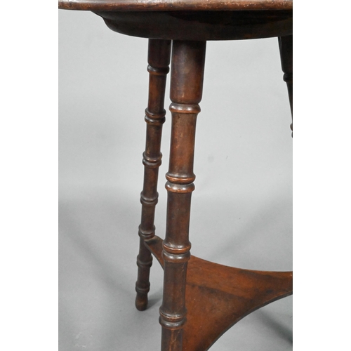 965 - A late Arts & Crafts circular occasional table, raised on three turned bamboo style legs united ... 