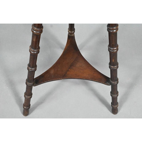 965 - A late Arts & Crafts circular occasional table, raised on three turned bamboo style legs united ... 