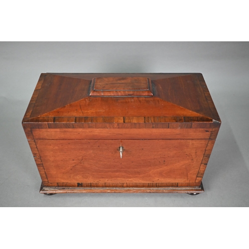 969 - A Regency mahogany sarcophagus form tea caddy, the interior with twin lidded boxes flanking a centre... 