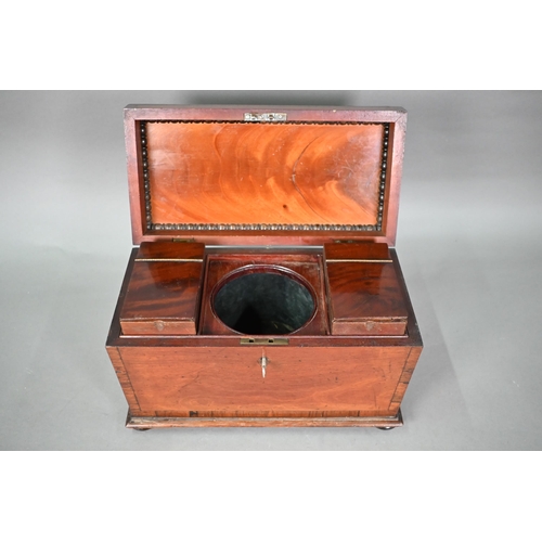 969 - A Regency mahogany sarcophagus form tea caddy, the interior with twin lidded boxes flanking a centre... 