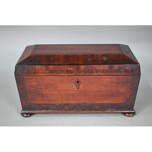 970 - A Regency rosewood cross-banded satinwood tea caddy, of sarcophagus form, the interior with twin hin... 