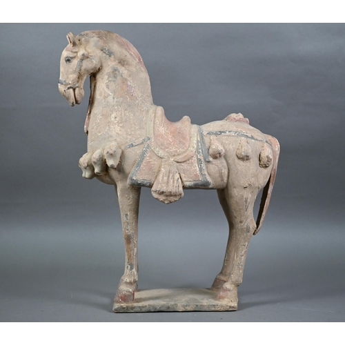 516 - A 20th century Chinese Tang style terracotta horse standing four-square on thin rectangular base, pa... 