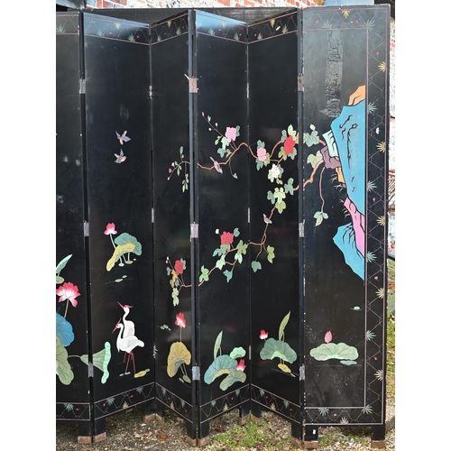 527 - A substantial early 20th century Chinese eight-panel folding screen or room divider, the black lacqu... 