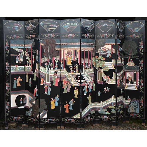 527 - A substantial early 20th century Chinese eight-panel folding screen or room divider, the black lacqu... 