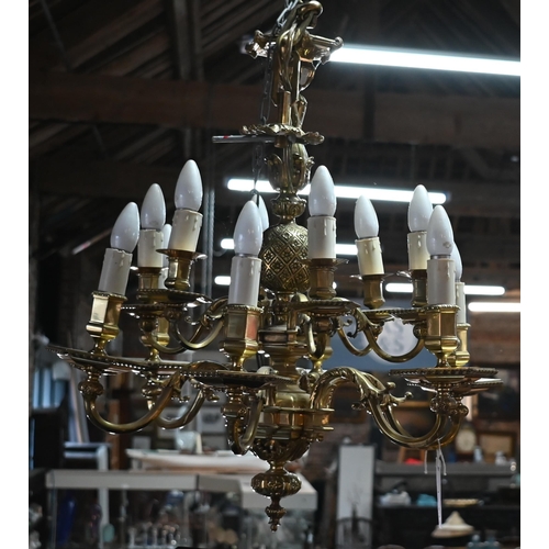 855 - A good heavy cast brass electrolier in the Aesthetic taste, the twelve branches arranged in to tiers... 