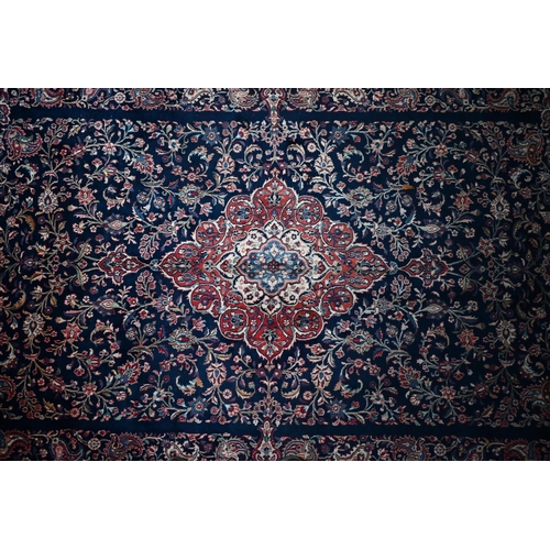 841 - A fine Persian hand-made Tabriz carpet, the blue ground centred by a medallion, 368 cm x 265 cm