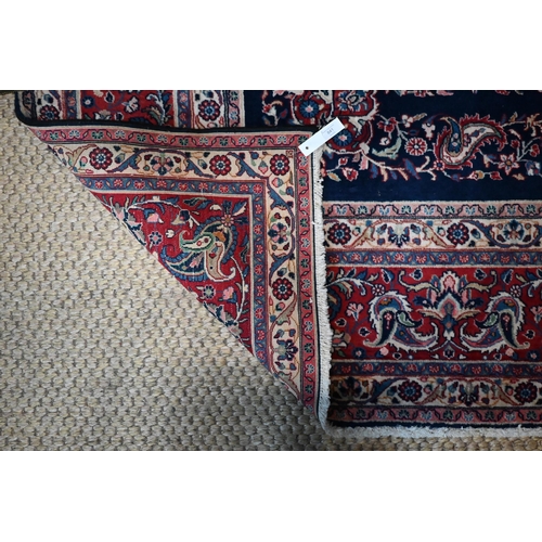 841 - A fine Persian hand-made Tabriz carpet, the blue ground centred by a medallion, 368 cm x 265 cm