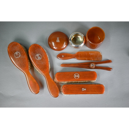 1225 - Vintage tortoiseshell seven-piece dressing table set with yellow metal monogram surmounted by a Baro... 