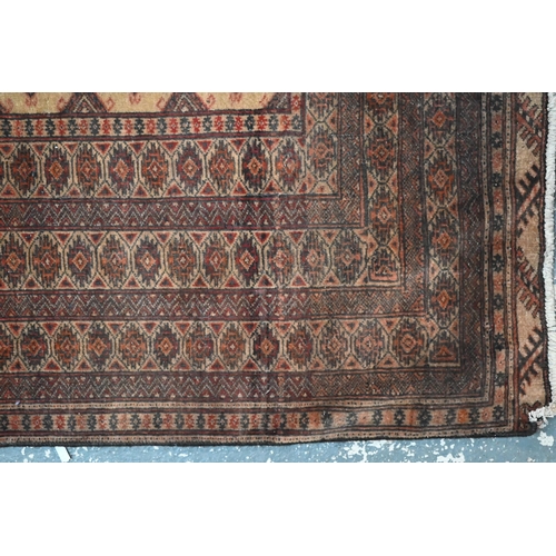 846 - A North East Persian Turkoman rug, camel ground, 224 cm x 124 cm