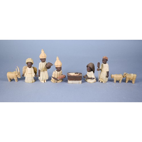 1226 - An African carved and stained wood set of Nativity scene figures - the largest 11 cm