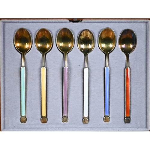 30 - Cased set of six Anton Michelsen (Copenhagen) silver gilt coffee spoons with Harlequin enamel finial... 