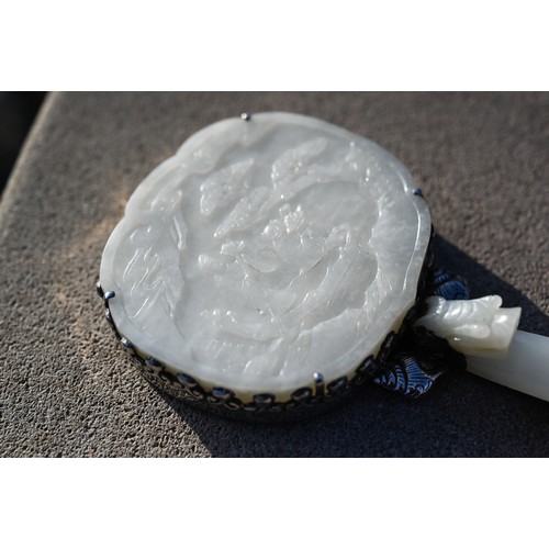 430 - A 19th century Chinese white jade and white metal mounted hand mirror, Qing dynasty, with cloud shap... 