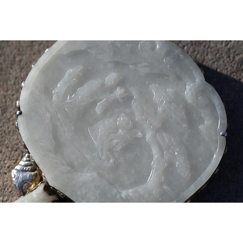 430 - A 19th century Chinese white jade and white metal mounted hand mirror, Qing dynasty, with cloud shap... 