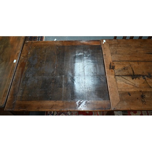 913 - An antique French fruitwood extending draw leaf dining table, with frieze drawer to one end, raised ... 