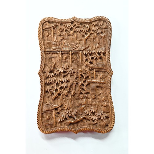 408 - A 19th century Chinese Canton sandalwood card case profusely carved with a village scene, dwellings ... 