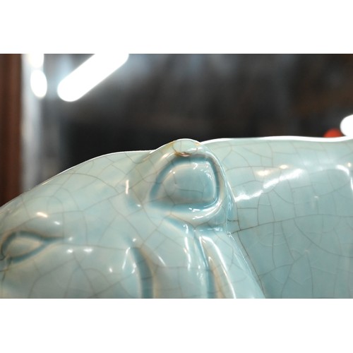 591 - An L&V Ceram large turquoise-glazed stalking tiger with overall crackle finish, on rectangular b... 