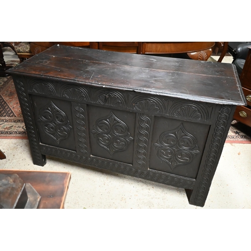 602 - An antique oak coffer with lunette and foliate carved panelled front, 130 cm wide x 58 cm deep x 76 ... 