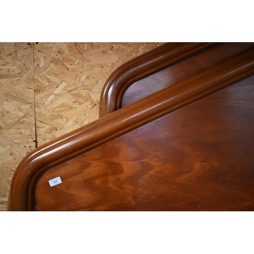 606 - A Kingsize stained hardwood bedframe with shaped mouldings and arched ends, 200 cm wide