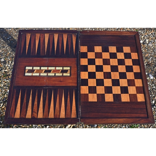 610 - A Regency rosewood games table, the rectangular fold over top revealing a chequers board and backgam... 