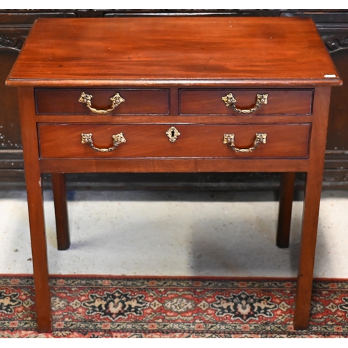 266 - A George III mahogany three drawer side table, with cast gilt-metal fittings, raised on inner-chamfe... 