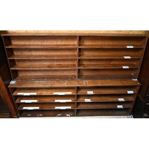 279 - An early 20th century oak two-section open bookcase inscribed 'In memory of Charlotte Alice Morris H... 