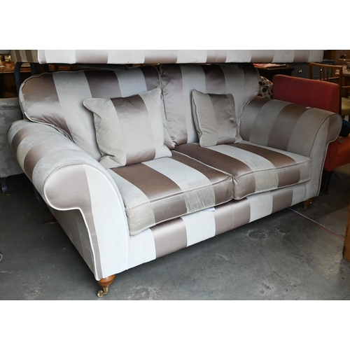 443 - A scoll arm three seater sofa with cream and gold striped fabric upholstery on hardwood legs (front ... 