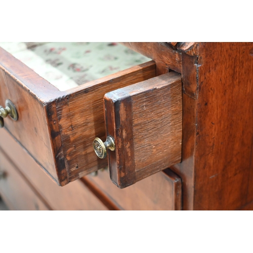 402 - A Georgian mahogany fall front bureau with fitted interior and four long graduating drawers standing... 