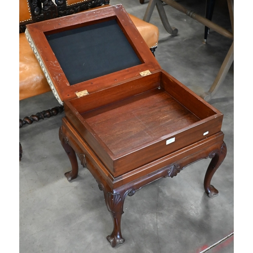 579 - A Victorian style carved mahogany box-seated piano stool with shell carved cabriole supports and abs... 