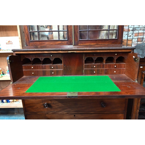 252 - A Regency mahogany secrétaire library bookcase, the associated two door astragal glazed cabin... 