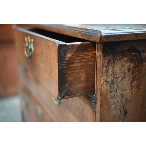 254 - An 18th century walnut chest on stand, with two short over three long graduated drawers with brass p... 