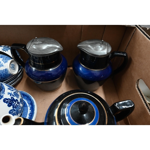 108 - Two Edwardian pottery hot water jugs with Art Nouveau pewter lids and a matching teapot on stand to/... 