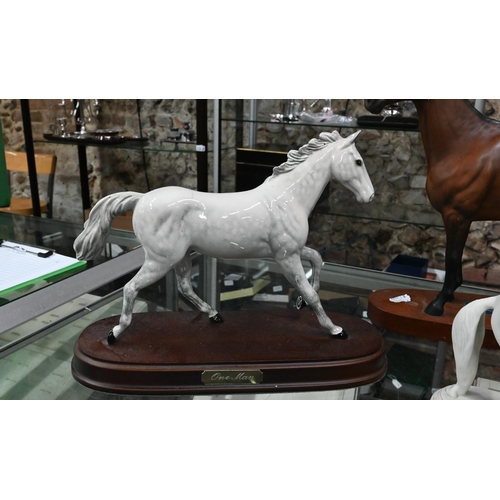 138 - Two Royal Doulton racehorses - One Man DA266 and Red Rum to/w a Beswick example, Arkle, a Levade bis... 