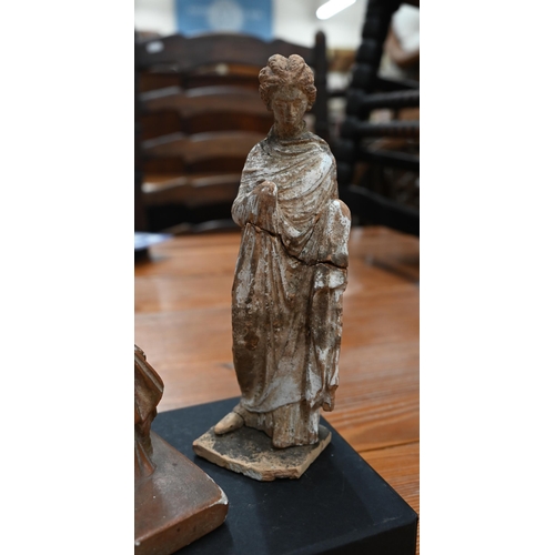 164 - Antiquity terracotta female figure in the Tanagra manner with vestigial slip draped robe, on square ... 